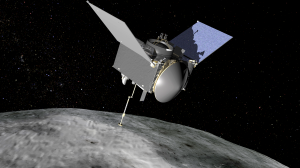 An artist's concept of the OSIRIS-REx spacecraft preparing to take a sample from the near-Earth asteroid called Bennu. The mission is scheduled for launch this September. (Credit: NASA)
